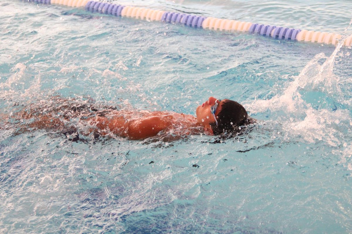 Alex Melendez paddles through his warmups before the meet against Gateway Charter