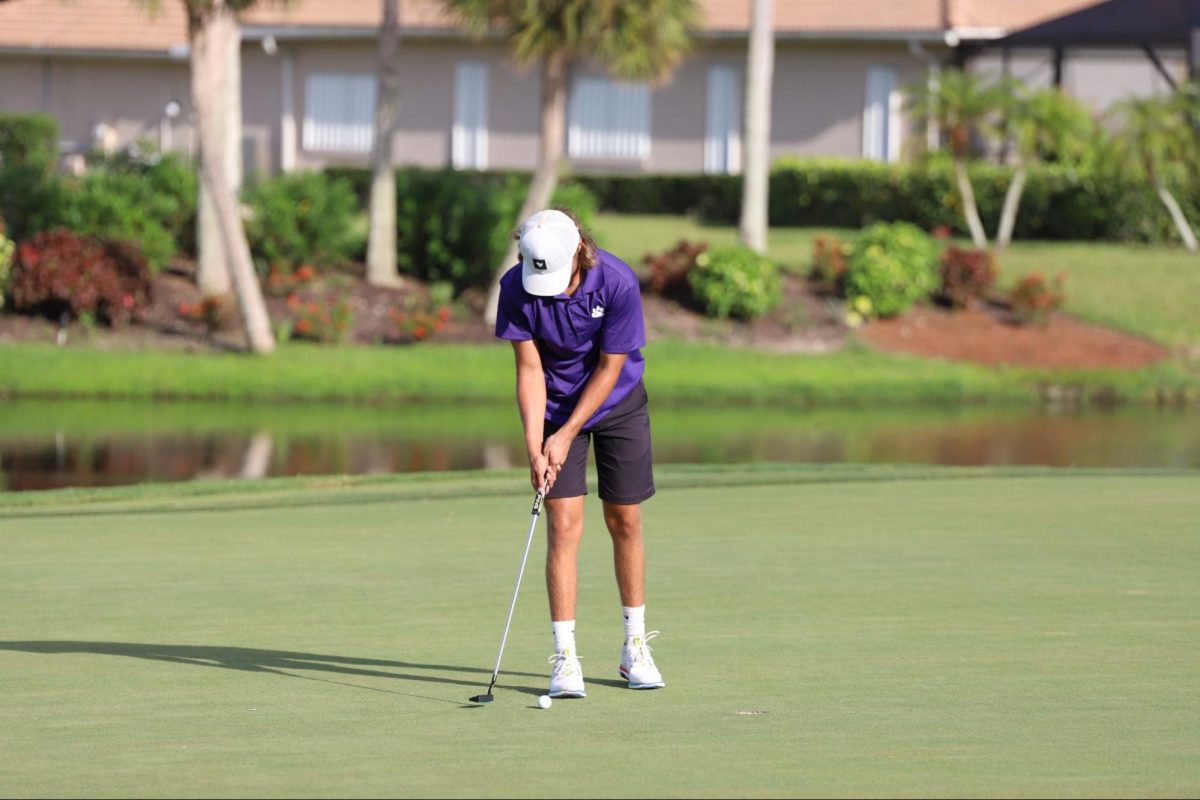 Trevor Whiteside Hamilton warms up his short game before a match