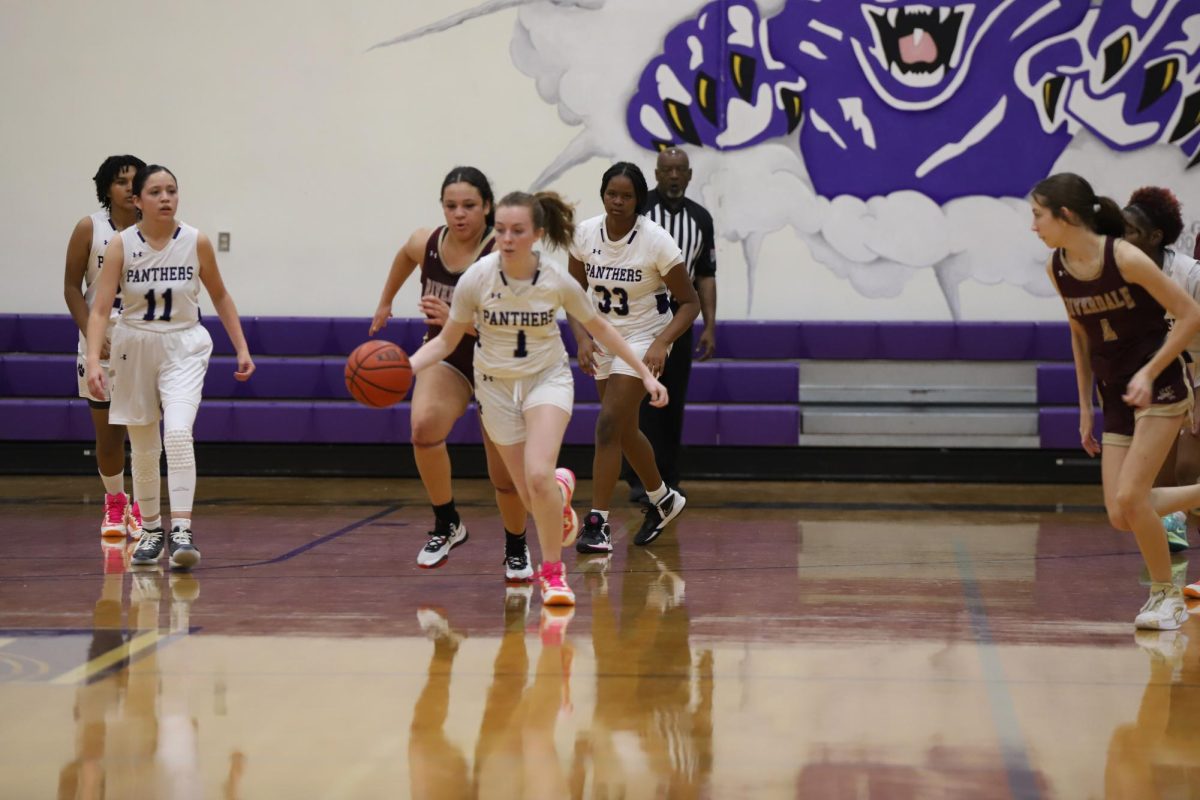 Senior Jenna Cook takes off on a fast break