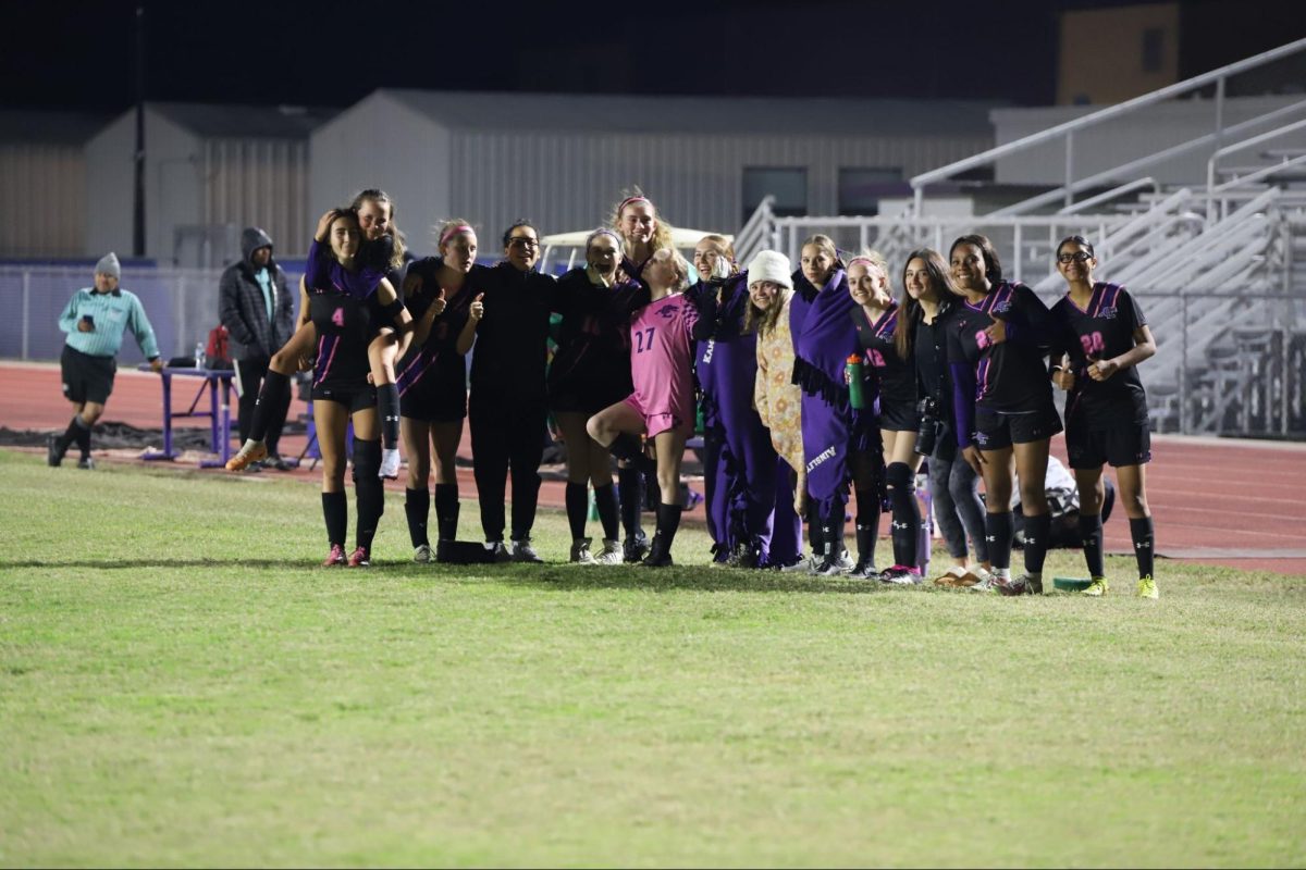 The girls soccer team celebrating after their most recent win.